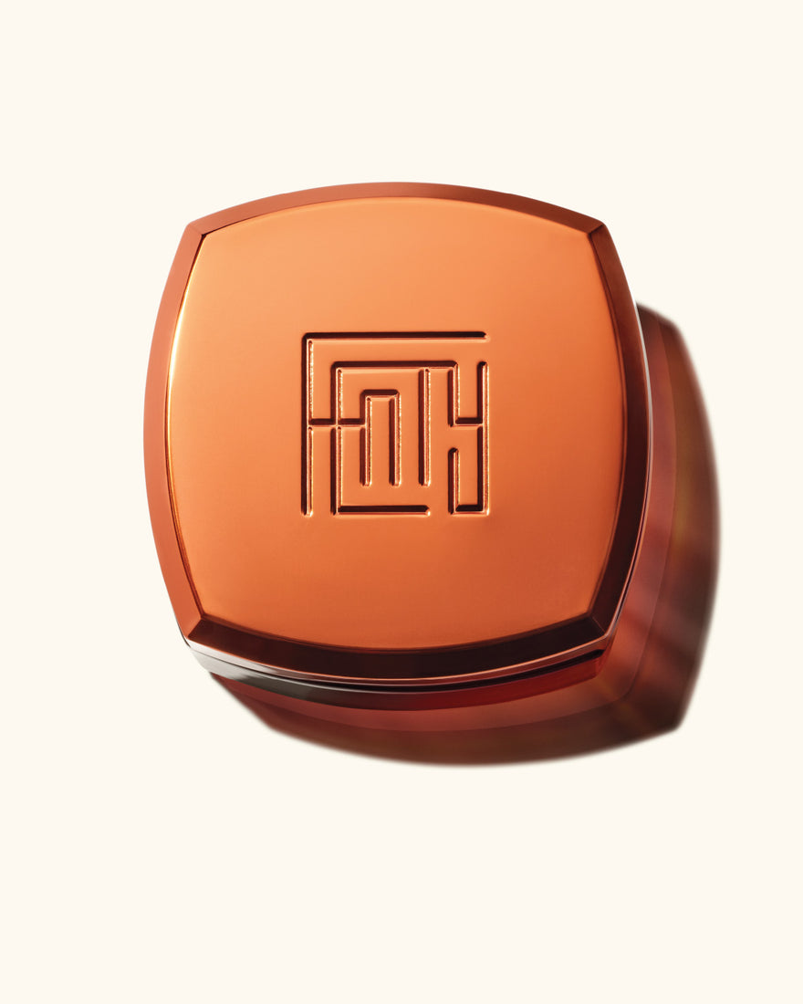 Close-up of the Fenty Parfum Bode Creme container top.