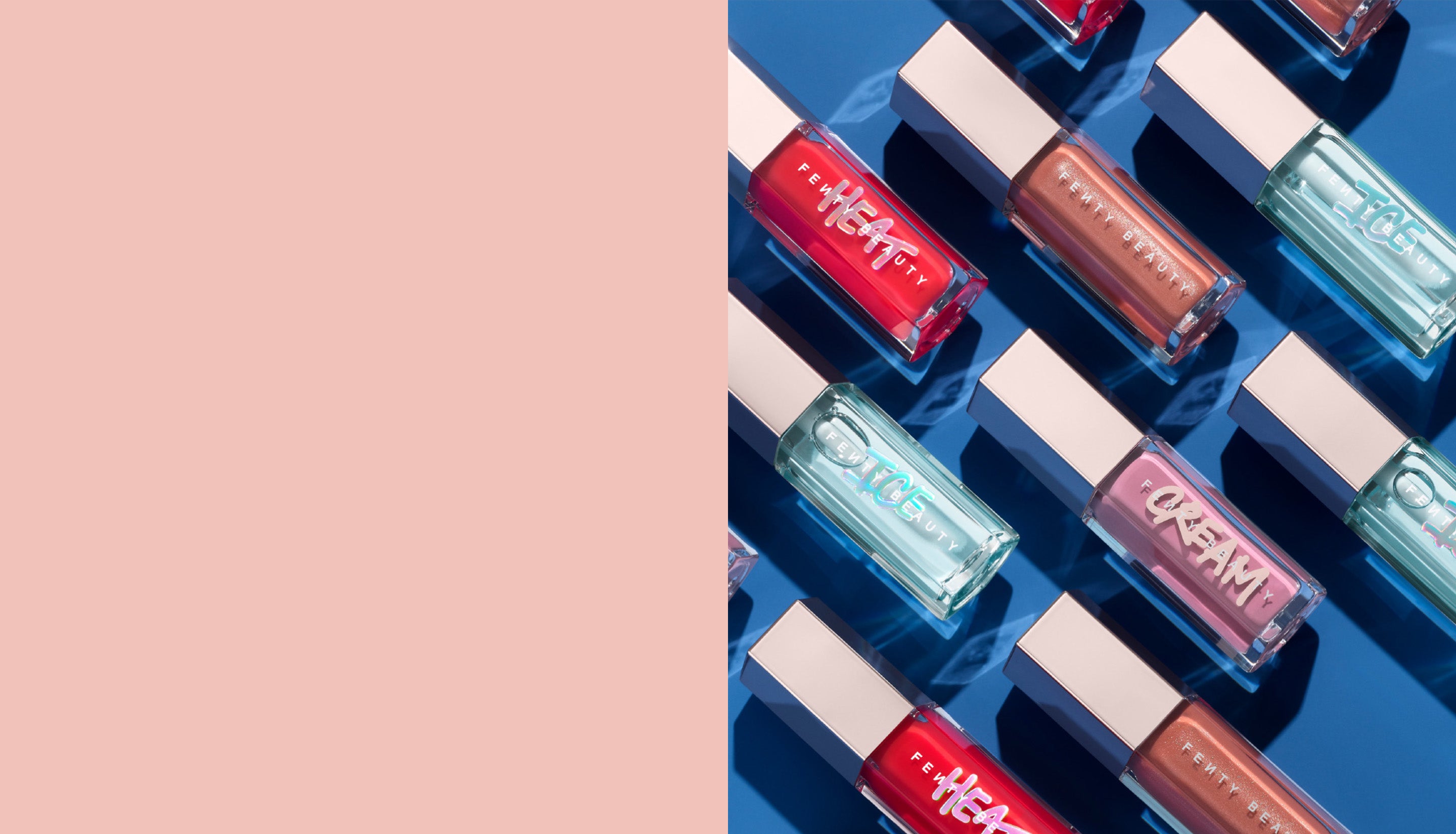 Editorial shot of Gloss Bomb Universal Lip Luminizer in Fenty Glow, Gloss Bomb Heat in Hot Cherry, and Gloss Bomb Ice in Cold Hearted lined up against a blue background.