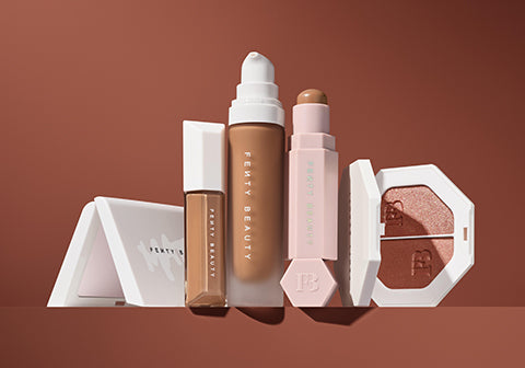 Open product shot of Fenty Beauty Invisimatte, We're Even Concealer, Pro Filter Foundation, Match Sticks Contour, and Killawatt Freestyle Highlighter Duo.